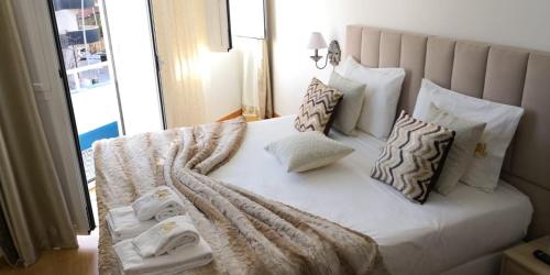 Uma cama ou camas num quarto em Soldouro Guesthouse