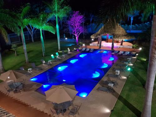 an overhead view of a swimming pool at night at Alilo by Muuk in Tepoztlán