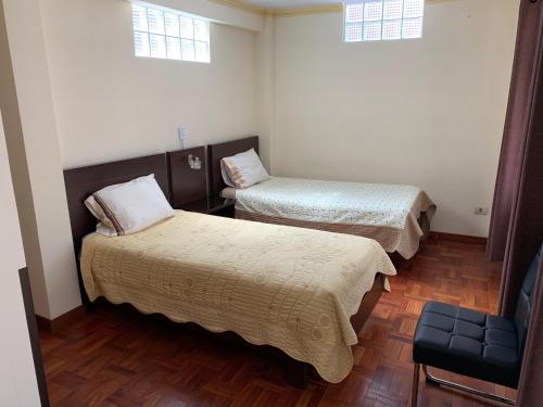 Residencial Alta Vista tesisinde bir odada yatak veya yataklar