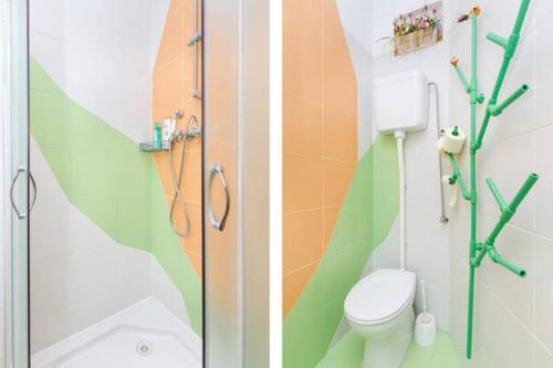 a bathroom with a shower and a toilet in it at Apartment Happy - in the center in Split