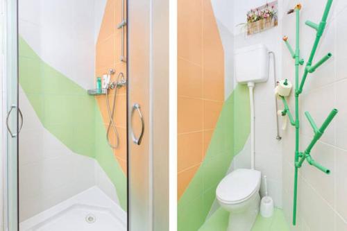 a bathroom with a shower and a toilet in it at Apartment Happy- in the center in Split