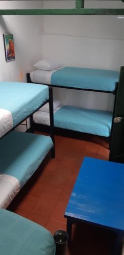 Postel nebo postele na pokoji v ubytování Cedron Hostel