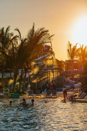 a group of people in the water at a water park at BIG4 Sandstone Point Holiday Resort Bribie Island in Bongaree