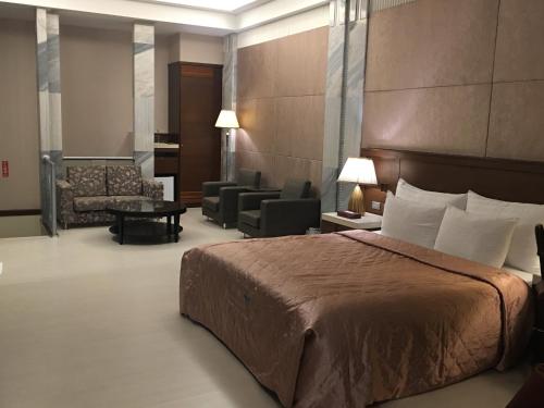 Postel nebo postele na pokoji v ubytování Jing Hwa Motel