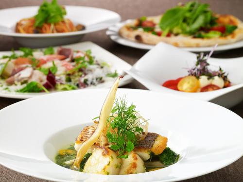 a group of plates of food on a table at The Prince Sakura Tower Tokyo, Autograph Collection in Tokyo