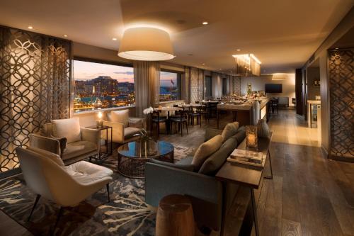 a large living room with a view of a city at PARKROYAL Darling Harbour, Sydney in Sydney