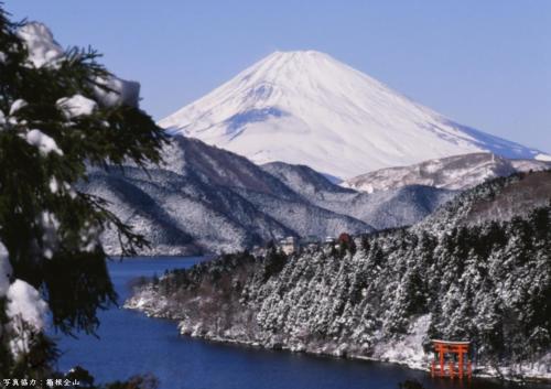 a snow covered mountain with a lake in front of it at Yutorelo-an ANNEX in Hakone