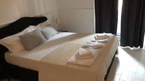 Postel nebo postele na pokoji v ubytování Intra' Residenza in Trastevere