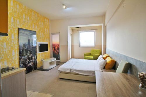 a bedroom with a bed and a table in it at Luxury Skopje Apartments Premium in Skopje
