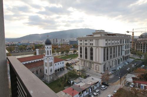a view of a city with a building and a clock tower at Luxury Skopje Apartments Premium in Skopje