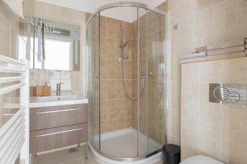a bathroom with a shower and a toilet and a sink at Apartma Smreka 144 in Kranjska Gora
