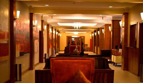 a room with tables and chairs in a building at Seascape Hotel in Dar es Salaam