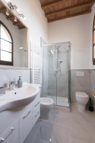 a bathroom with a sink and a shower and a toilet at Era Rental Apartments in Florence