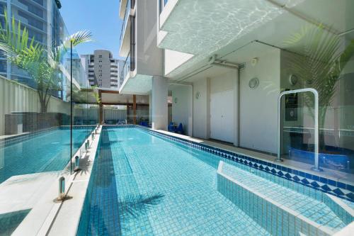 a swimming pool on the side of a building at Hotel Diana South Brisbane in Brisbane