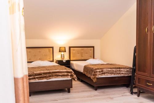 Postel nebo postele na pokoji v ubytování Hotel Artur