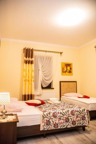 Postel nebo postele na pokoji v ubytování Hotel Artur