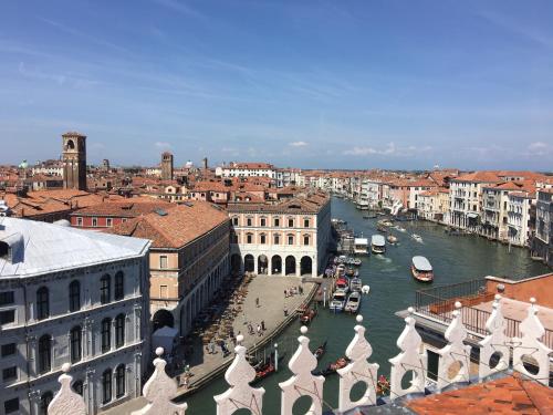 a view of a city with a river and buildings at Dune Prestige & Chalets in Bibione