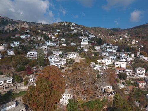 a village on a hill with white houses at 1822 Makrinitsa Suites in Makrinítsa
