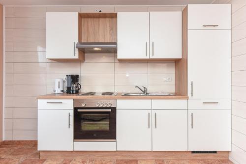 Dapur atau dapur kecil di Ferienwohnungen An Deck