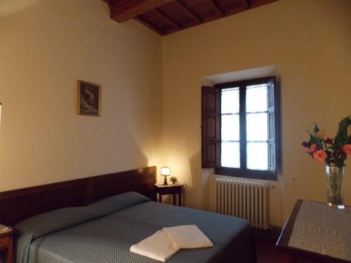 מיטה או מיטות בחדר ב-Il Villino