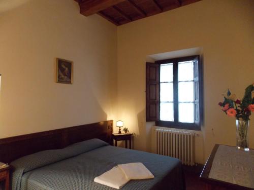 A bed or beds in a room at Il Villino