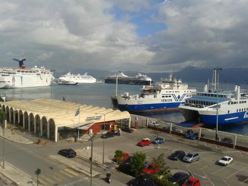 a group of cruise ships docked in a harbor at Hotel Atlantis in Corfu Town