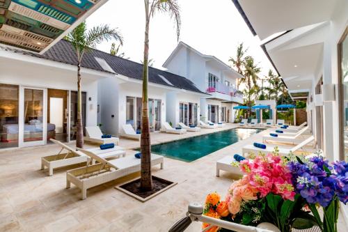 an image of a villa with a swimming pool at Cocotoa Boutique Hotel & Villa in Gili Trawangan