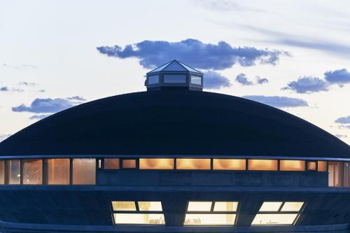 a building with a clock tower on top of it at Shonai Hotel Suiden Terrasse in Tsuruoka