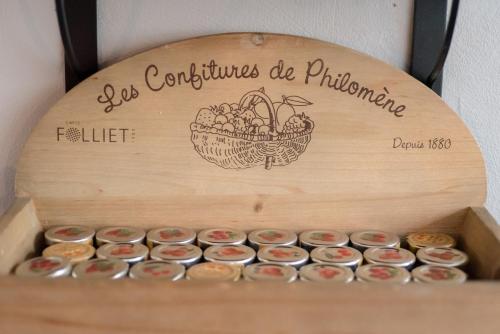 a wooden box filled with lots of cupcakes at Cit'Hotel Criden in Tours