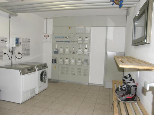a laundry room with a washer and dryer at Appartement Haute Nendaz met fantastisch uitzicht in Nendaz