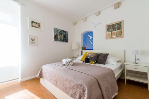 a bedroom with a bed with a teddy bear on it at Apartments Tereza in Dubrovnik