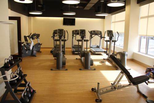 a gym with several treadmills and exercise bikes at Northern Hotel in Billings
