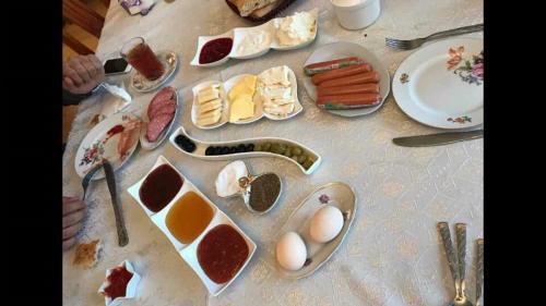a table with eggs and other food on it at House in Quba in Quba