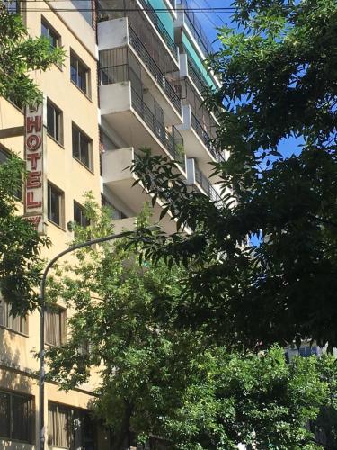 a building with a sign on the side of it at Hotel Rey in Buenos Aires