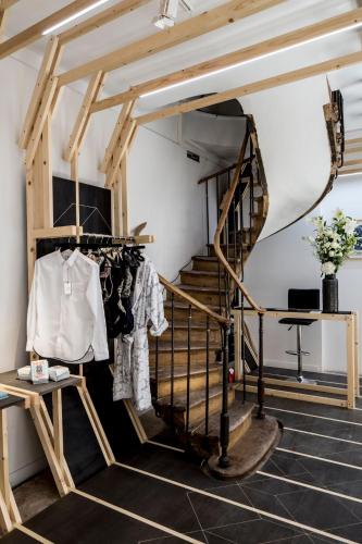 a spiral staircase in a room with a stair case at Hotel Les Bains Paris in Paris