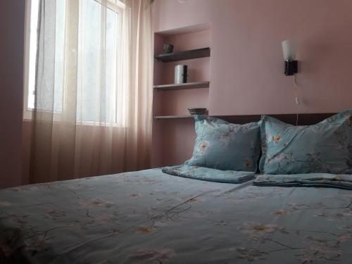 Ένα ή περισσότερα κρεβάτια σε δωμάτιο στο Luxuri Apartment