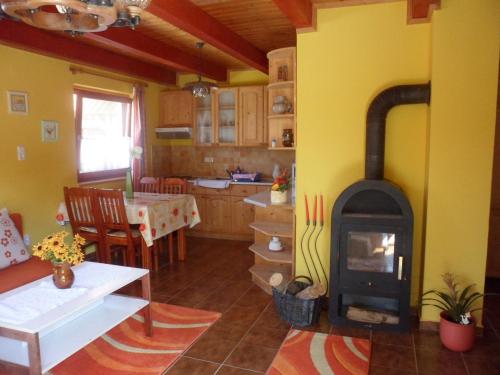 a kitchen with a stove in the middle of a room at Apartment in Balatonbereny/Balaton 18043 in Balatonberény