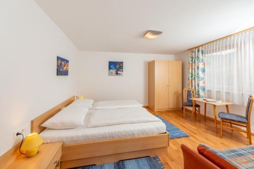 Un pat sau paturi într-o cameră la Appartementhaus Steirergasse by Schladming-Appartements