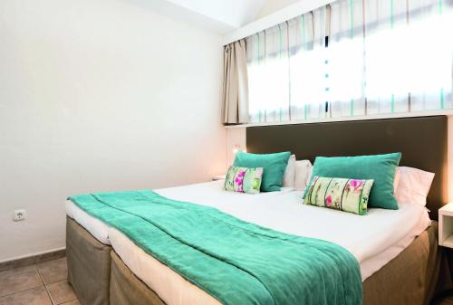 Postel nebo postele na pokoji v ubytování Grupotel Las Pitas