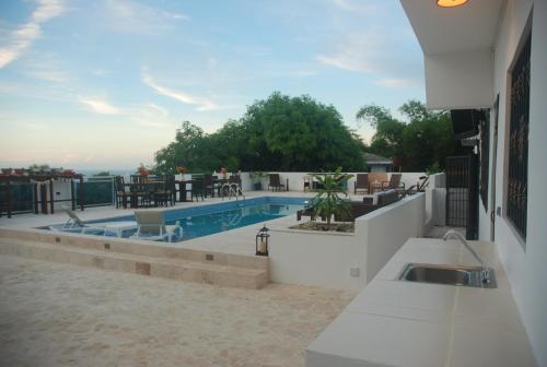 a swimming pool on the roof of a building at E&J Boutique Residences in Sosúa