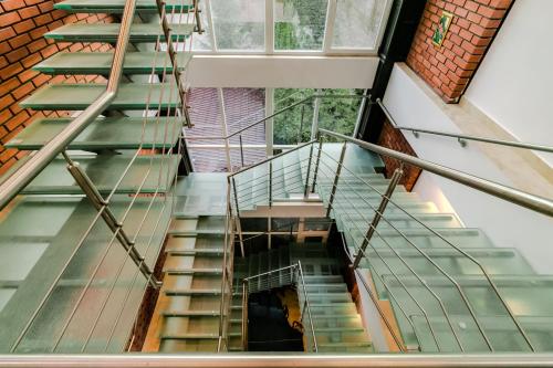 a spiral staircase in a building with a window at Hotel Marina in Pucioasa