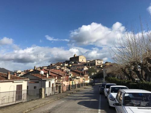 a city street with cars parked on a hill at Hotel San Giuliano in Accettura