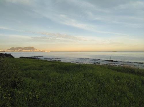 a view of the ocean from a beach at Punta Carnero Hostal in Algeciras