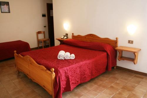 Ένα ή περισσότερα κρεβάτια σε δωμάτιο στο Hotel Residence Turium