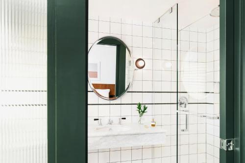 a bathroom with a sink and a mirror at Palihotel Culver City in Los Angeles