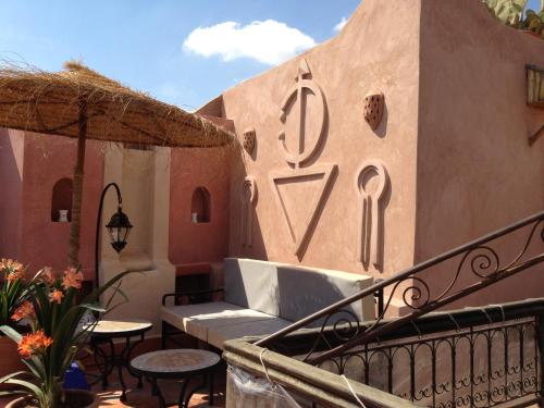 a house with a sign on the side of it at Riad Mehdia in Marrakech