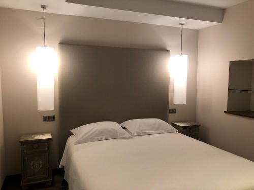 Ένα ή περισσότερα κρεβάτια σε δωμάτιο στο Apartament Casa Rey