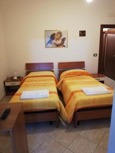 מיטה או מיטות בחדר ב-LOCAZIONE TURISTICA " Su Passizzeri "