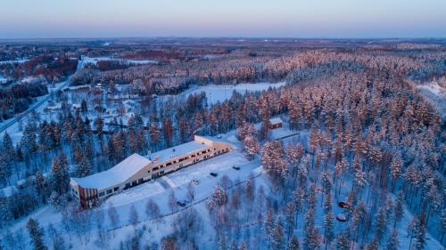an aerial view of a train on a snowy mountain at Hotel Julie in Joensuu