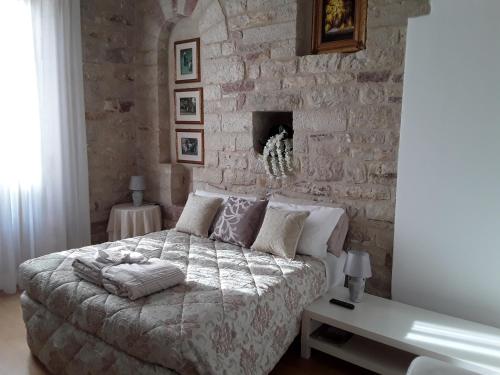 Postel nebo postele na pokoji v ubytování Suite Assisi